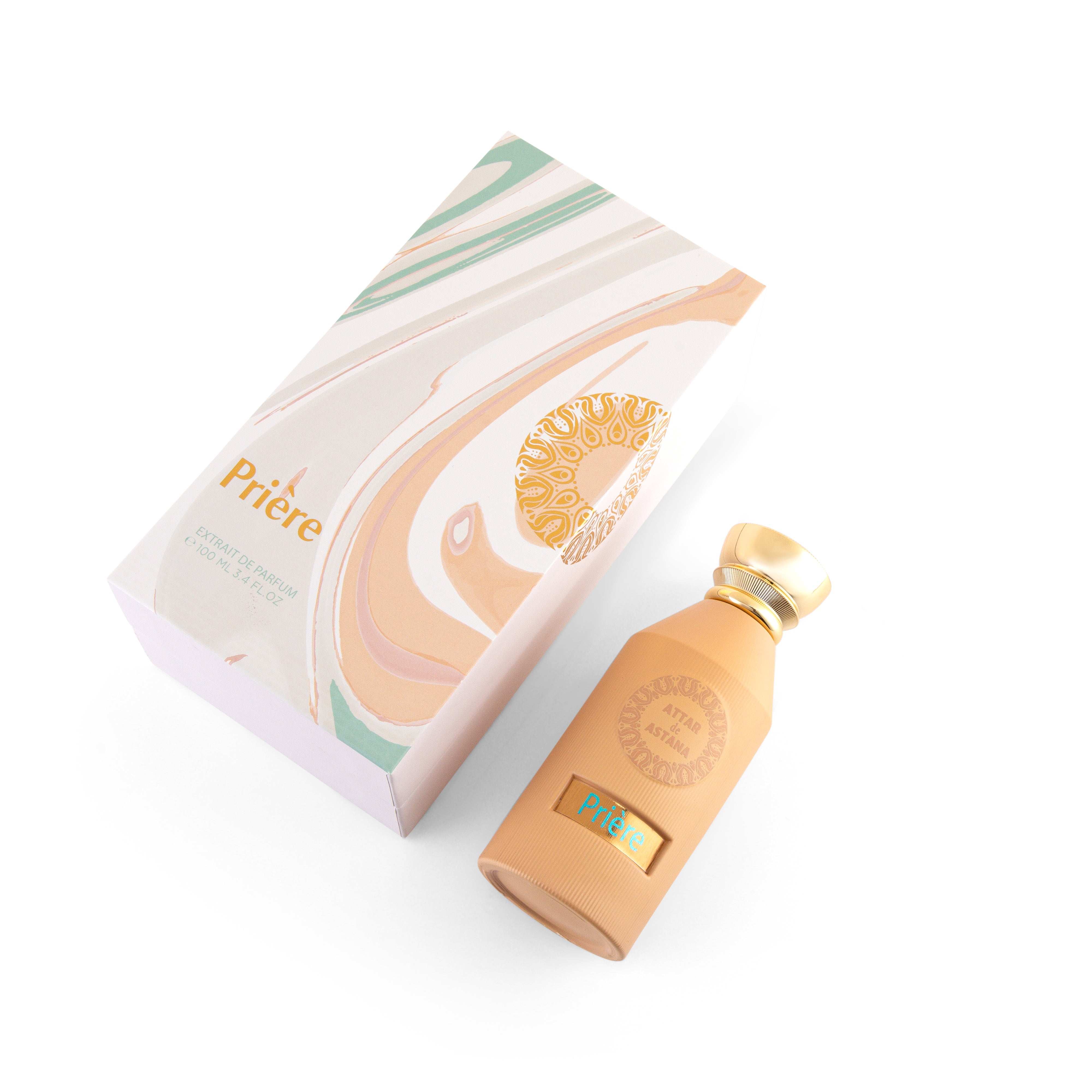 Priere Beige bottle with gold cap and packaging on a white background